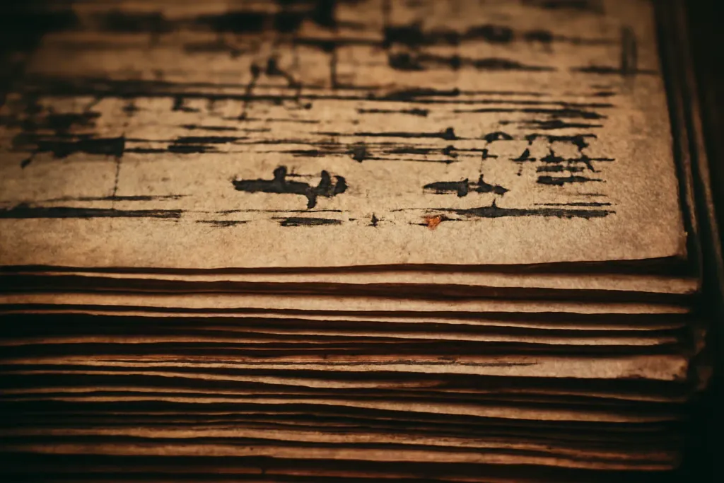 A close, textured detail of typeset proof sheets and ink.
